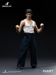 A detailed close up photograph showcasing the facial sculpt features and hair texture of the Bruce Lee one twelfth scale figure.