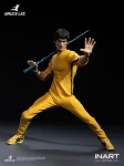 The 1/12 scale InArt Bruce Lee action figure is posed dynamically holding his signature nunchucks accessory.