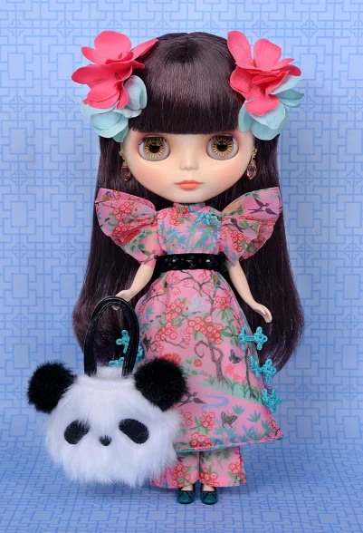 Front full portrait of the CWC Limited Neo Blythe KEITA MARUYAMA Jade Garden doll standing in her complete chinoiserie floral dress with black velour belt and panda bag.
