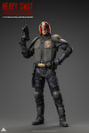the one sixth scale Heavy SWAT figure in a dynamic action pose holding the tactical assault rifle and heavy duty riot shield.