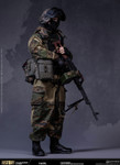 turning the figure around reveals the complex web of modular pouches and radio equipment attached to the back of the tactical vest.