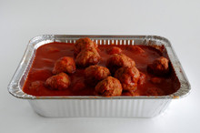 Meatballs in sauce in a pan.