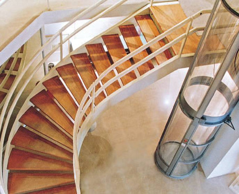 A sharp view of the PVE30 Model installed next to curved stairs.