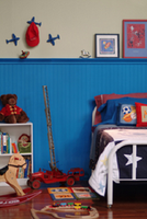 Beaded Birch paneling, painted blue used with plate shelf.  Tall Wainscoting application