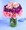 Pretty petals in a tiered design make a unique bouquet. Pink carnations form the first tier; deep lavender alstroemeria fill the center, and three luscious pink roses are the crowning touch. A stylish design for anyone who appreciates something above the ordinary.