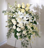 This soft standing spray is a sophisticated way to pay a quiet tribute. White fragrant Oriental lilies, roses, stock or snapdragons.