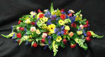 A summer-like mix of the freshest flowers to help express your love and devotion. This piece is usually sent by immediate family. We can deliver this piece with a personal script, we print in our flower shop.