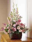 An array of pink blooms artfully arranged is a celebration of life and a special memory of a dear friend or loved one.