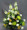 A pewter-coloured vase holds this yellow and white combination. Colours may be changed to suit your requirements. White Snapdragons, green Rivert Chrysanthemums, white Carnations, and sunny yellow Statesman Chrysanthemums make a one-sided arrangement