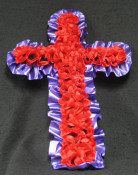 A sophisticated purple cross with silk red poppies. This memorial is perfect for a loved one who lost their life during the war.