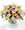 Comfort with the affection of refined mixed pastel roses and sophisticated greenery in a pedestal vase.