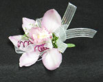 A pin on type, with pink mauve wire. We also make wristlets. A double Cymbidium corsage.