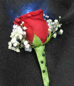 Single red Rose boutonniere and Baby Breath. And a funky white LED light. Shine on! The light lasts 24 hours, a great effect!