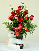 Lovely Valentine keepsake white bear 12 inches or 28cm.12 Red Freedom rose from Ecuador and mixed foliage. Cupid bow and heart pick.