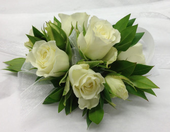 White spray roses are really petite and lovely. We a can use other colours as well, please call in advance or order 5 to 7 days ahead. In store we have extra special wristlets by Fitz Design.  We custom make each corsage in our Toronto/North York shop. We really appreciate the advance orders. Do not forget the boutonnieres.