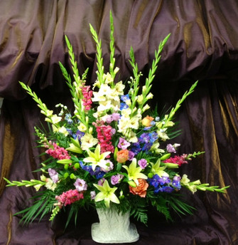 Gladiolus, snapdragons, lilies, roses and lisianthus in our traditional styled Summer Tribute. We deliver to all funeral homes in the Toronto and GTA area. We also sell banners for the funeral work.