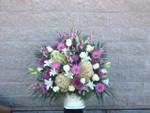 Pastel mixed flowers including PeeGee hydrangea, white oriental lilies, mauve snapdragons, pinky mauve dahlias and alstromeria. A quiet sentiment for any funeral floral offering of you sympathy. We can design one for you in our Toronto and North York area flower shop. Selling flowers in Toronto for over 100 years.