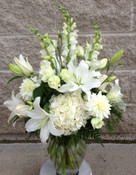White flowers in all varieties and shapes. Let Hatcher Florist help you express your feelings with this vase of white snapdragons, asiatic lilies, hydrangea, lisianthus and dahlias. We will make one up fresh for you in our Toronto-North York flower shop. 