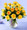 Bright yellow roses arranged in a vase with mixed greenery. We use hummer or Gold Strike roses.Sunny and bright 24 graceful yellow long stem roses are arranged with greens in a clear glass vase. Sunny enough for a celebration, but soothing enough for a Get Well or Sympathy gift. We do have other colours!