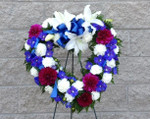 Express your love and sympathy with this lovely mix of blue, white and magenta flowers in a fresh flower heart. We deliver to all funeral homes, chapels and cemeteries in Toronto, North York, Markham, Vaughan and the GTA. Flowers made fresh daily by our skilled florists. 