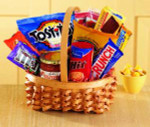 No matter the occasion, they'll appreciate our Big Munch basket. An oval braided basket holds sweet and salty munchies - Tostitos and salsa, pretzel sticks, chocolate cookies, candy bars and popcorn.  products may vary.