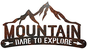 Mountain Dare To Explore is a rustic metal sign