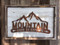 Mountain Dare To Explore is a rustic metal sign mounted on shabby chic reclaimed wood.