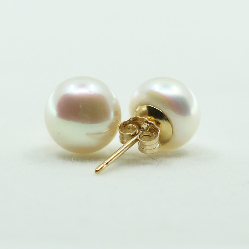 Classic pearl studs for everyday wear.