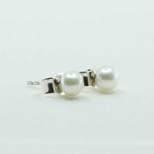 Tiny cream freshwater pearl studs