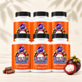 Natural Home Cures Freeze-Dried Rich Pericarp Mangosteen supplement bottle with loose capsules and whole mangosteen fruit