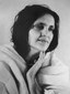 5"x7" Black and White photo of Anandamayi Ma with fingers on chin.
