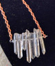 Natural Raw Quartz Crystal Necklace. 7 mini Quartz crystal points. Copper plated chain necklace measures approx 17".

Natural Quartz Crystals amplify positive energy. 

Keep Calm and Wear Your Crystals.

What is your lucky number? We can make these to order with 1,2,3,4,5,6 or 7 Natural Raw Quartz Crystal Points.

Copper or Silver Plated chain available.

Also available in Sterling Silver. Price available on request.

Free shipping in the USA