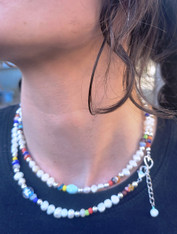 Pearl Choker. Freshwater Pearls mixed with playful colorful Crystal, Glass and Gemstone Beads.
No two are alike but are very similar as shown in the picture.
This listing is for one necklace.
Available in 14", 16" or 18" with 1.5 extender chain with secure lobster Claw clasp.
On trend Playful Pearl Choker.

Handmade in Tucson, Arizona

We also offer plain Freshwater Pearl Chokers in all lengths. Please message with your requests.

