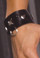Elegant Moments Leather wrist cuffs with square nail heads and O rings. Black