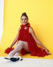 SHARON TATE STRIKING POSE AGAINST YELLOW BACKDROP IN RED DRESS PRINTS AND POSTERS 288589