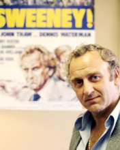JOHN THAW THE SWEENEY POSING IN FRONT OF MOVIE PRINTS AND POSTERS 288352