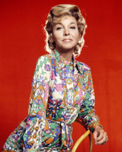 BEVERLY GARLAND IN FUL DRESS AGAINST RED BACKDROP CIRCA 1970'S PRINTS AND POSTERS 287503