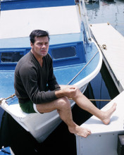 GARY LOCKWOOD BAREFOOT IN SHORTS ON BOAT 1960'S PRINTS AND POSTERS 286864