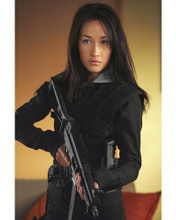 MAGGIE Q HOLDING RIFLE PRINTS AND POSTERS 272170