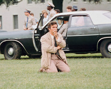 PETER FALK KNEELING ON GRASS BY CAR AS COLUMBO PRINTS AND POSTERS 264011