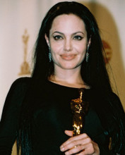 ANGELINA JOLIE HOLDING AWARD PRINTS AND POSTERS 241611