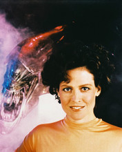 SIGOURNEY WEAVER WITH ALIENS BEHIND PRINTS AND POSTERS 24119