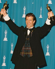 MEL GIBSON HOLDING 2 OSCAR'S ALOFT PRINTS AND POSTERS 219302