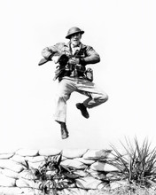 ROBERT TAYLOR BATAAN LEAPING IN AIR WITH RIFLE PRINTS AND POSTERS 195410