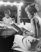EARTHA KITT CANDID READING REFLECTION IN VANITY MIRROR PRINTS AND POSTERS 193683
