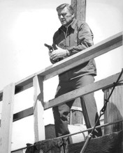 JOHN WAYNE MCQ WITH GUN ON BOAT DOCK PRINTS AND POSTERS 190794