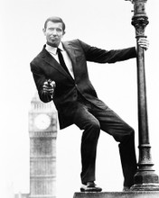 GEORGE LAZENBY HOLDING GUN BIG BEN IN BACKGROUND AS 007 PRINTS AND POSTERS 163201