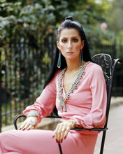 CHER IN PINK JUMPSUIT SEATED IN CHAIR PRINTS AND POSTERS 292097