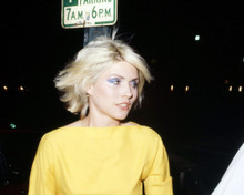 DEBORAH HARRY YELLOW TOP BY STREET SIGN COOL IMAGE PRINTS AND POSTERS 292285
