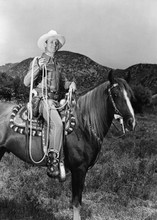 Gene Autry western great riding his horse holding lassoo 5x7 inch photo